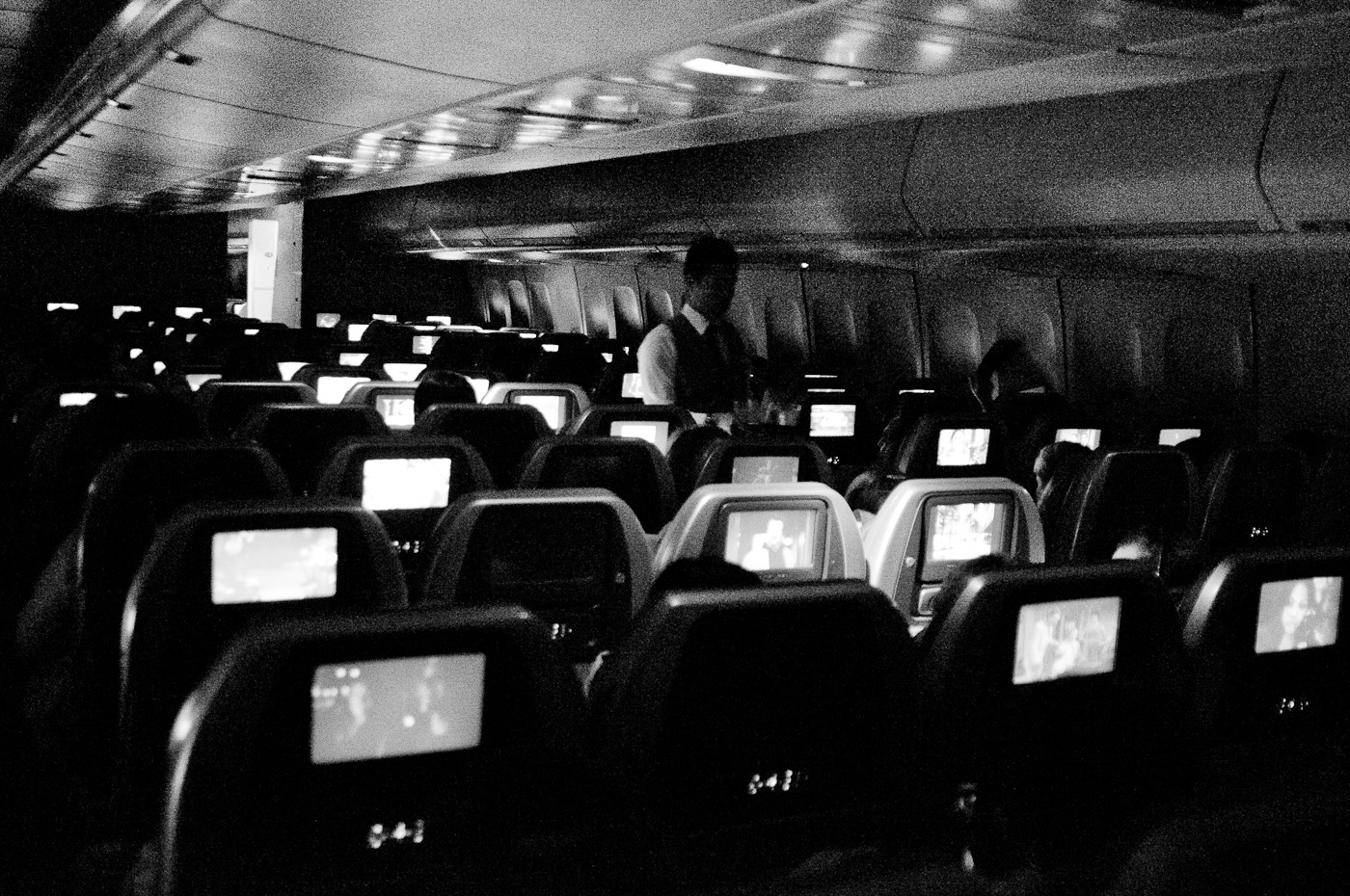 A very gritty but beautiful picture inside a commercial flight at 25600ISO. Sony NEX-5n